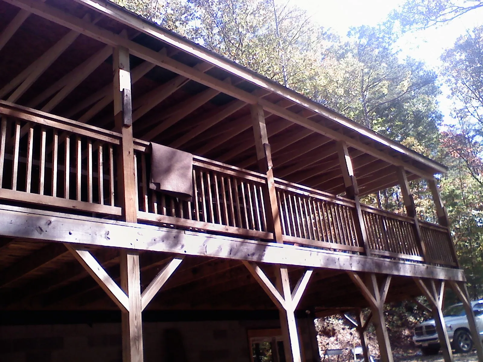 Timber framing under a new elevated porch and deck — Roof Leak Repair in Buffalo by Roofing Brothers